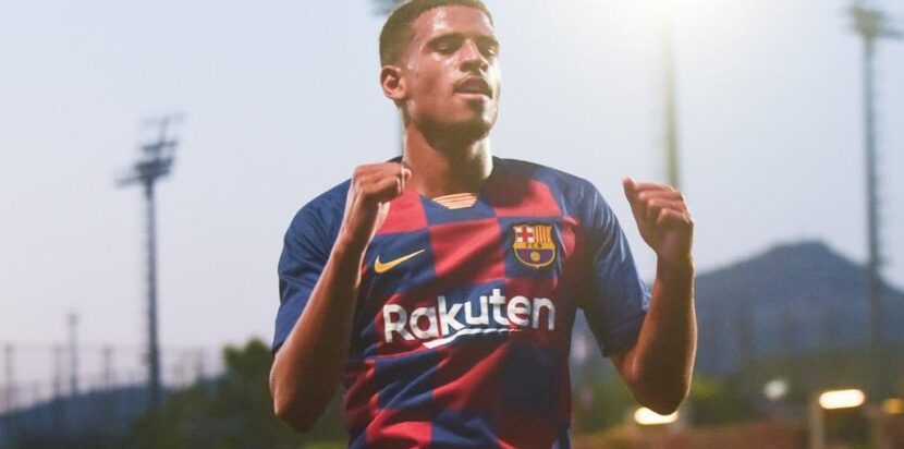 Marcus McGuane merayakan gol bersama Barcelona.